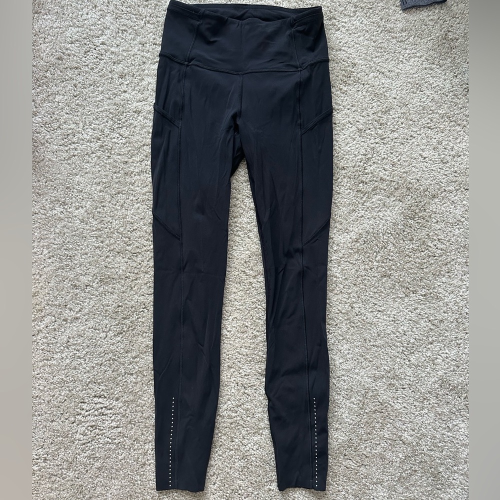 Black lululemon high rise leggings with pockets. Size 4.